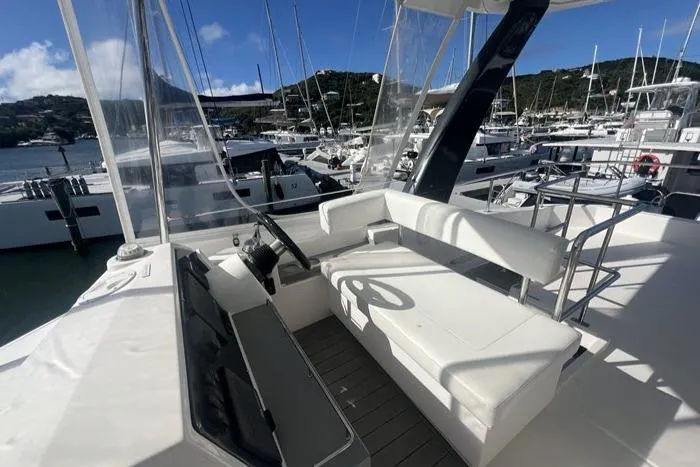 Rockin U Yacht Photos Pics Leopard 43 Powercat 2020 model, featuring spacious seating and helm, docked in a marina.