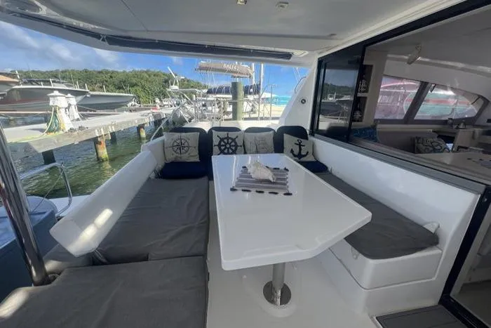 Rockin U Yacht Photos Pics Leopard 43 Powercat 2020 yacht interior with cushioned seating and nautical-themed decor.