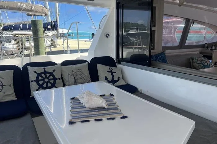 Rockin U Yacht Photos Pics Leopard 43 Powercat 2020 yacht interior with nautical-themed cushions and table setting.