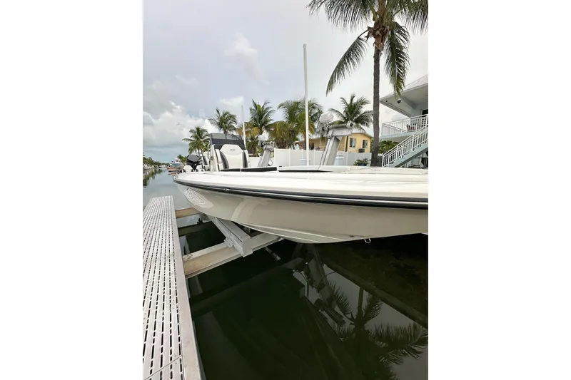  Yacht Photos Pics 2021 ShearWater 270 Carolina Flare boat docked near palm trees.