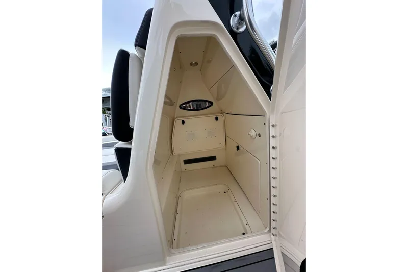  Yacht Photos Pics 2021 ShearWater 270 Carolina Flare interior cabin with storage space and seating.