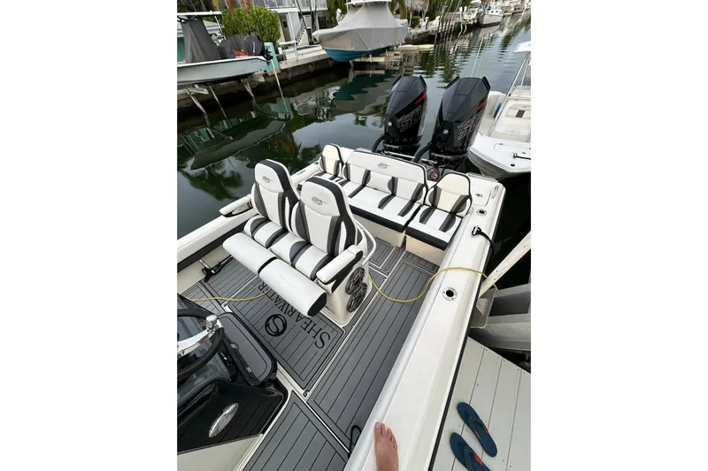  Yacht Photos Pics 2021 ShearWater 270 Carolina Flare boat with dual engines, docked in a marina.