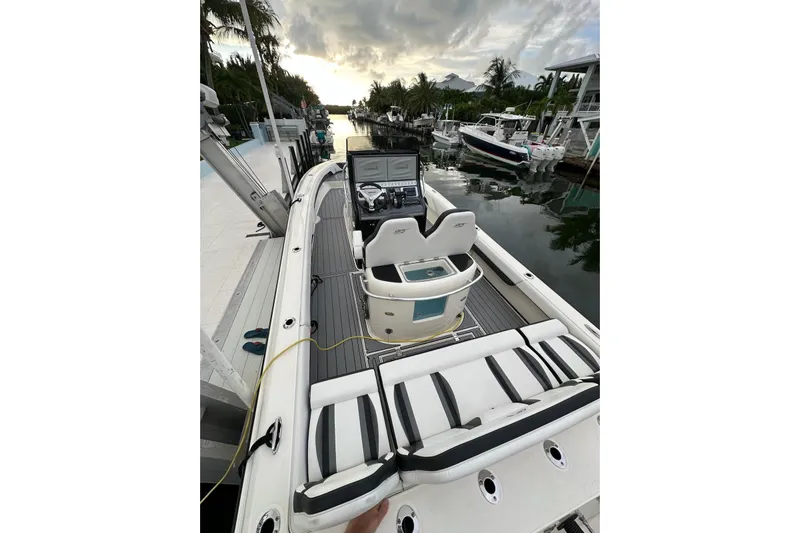  Yacht Photos Pics 2021 ShearWater 270 Carolina Flare boat docked, featuring sleek design and modern controls.