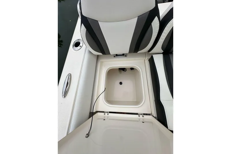  Yacht Photos Pics 2021 ShearWater 270 Carolina Flare boat seat with storage compartment open.