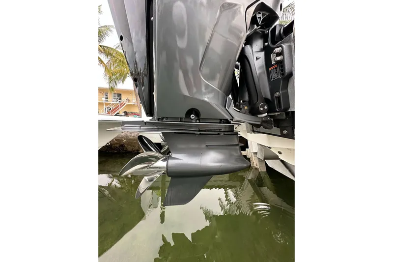  Yacht Photos Pics Close-up of 2021 ShearWater 270 Carolina Flare boat engine and propeller in water.