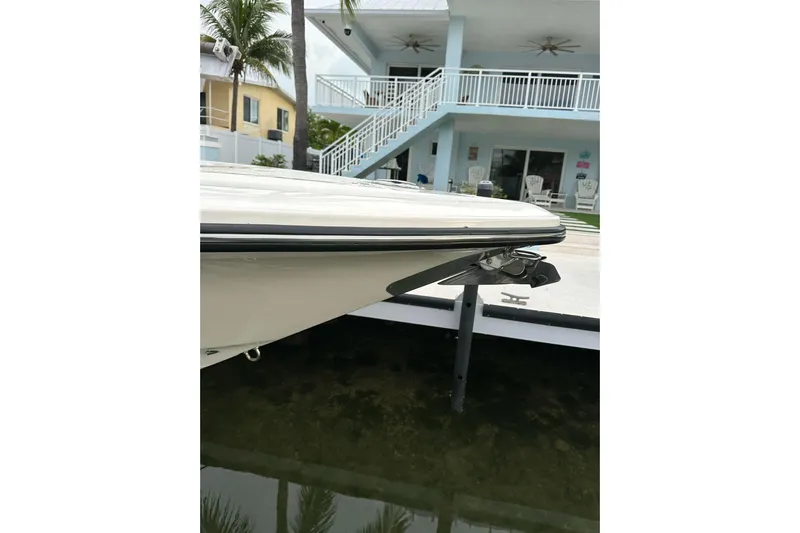  Yacht Photos Pics 2021 ShearWater 270 Carolina Flare boat docked near waterfront home.