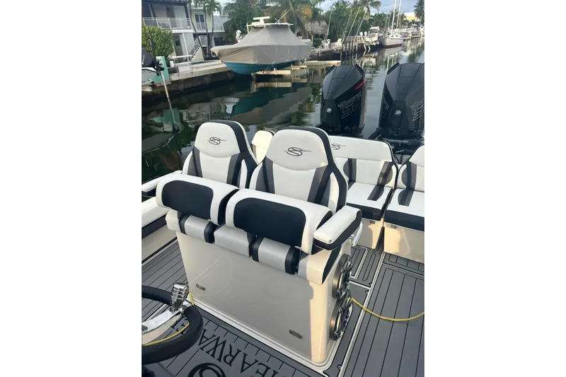  Yacht Photos Pics 2021 ShearWater 270 Carolina Flare boat interior with stylish seating and twin engines.