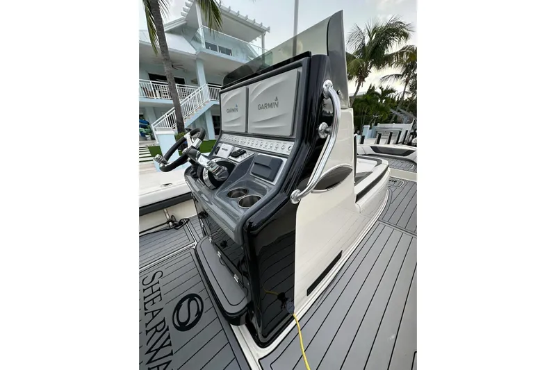 Yacht Photos Pics 2021 ShearWater 270 Carolina Flare boat console with Garmin displays and sleek design.