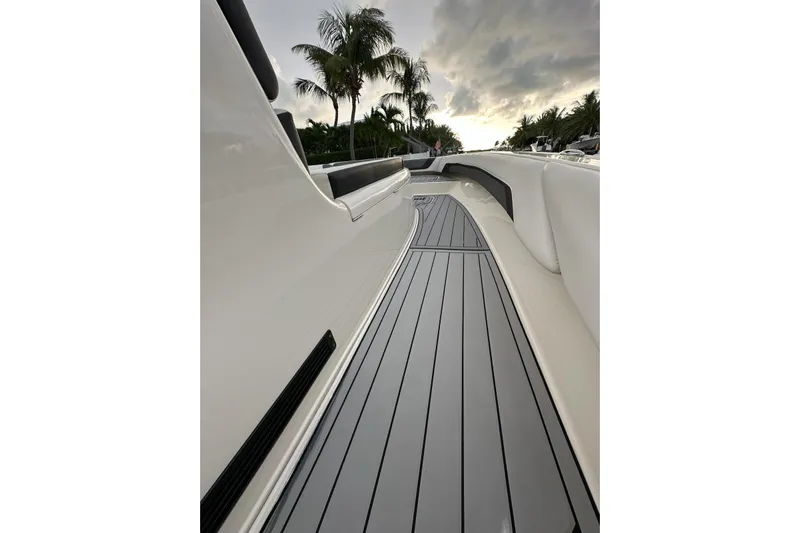  Yacht Photos Pics 2021 ShearWater 270 Carolina Flare boat deck with sleek design and palm trees in background.