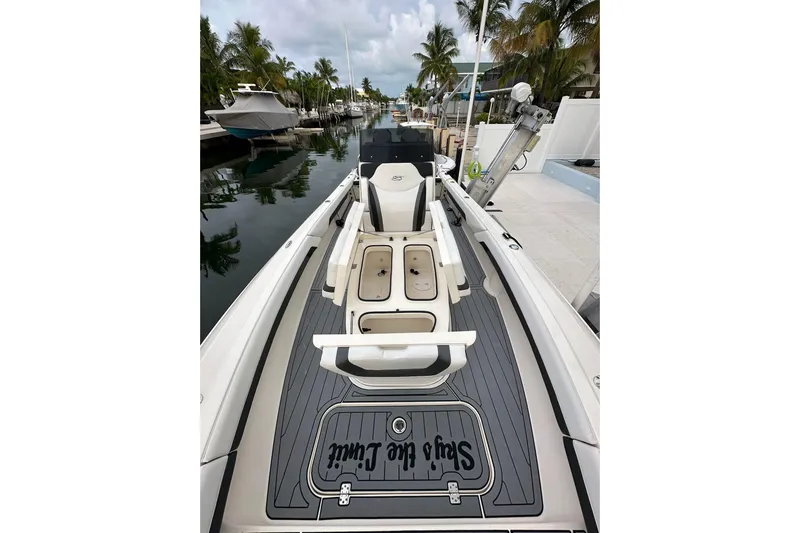  Yacht Photos Pics 2021 ShearWater 270 Carolina Flare boat docked, featuring sleek design and spacious deck.