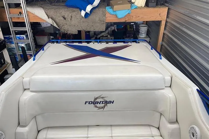  Yacht Photos Pics 2001 Fountain 35 Lightning boat interior with logo, stored in a garage.