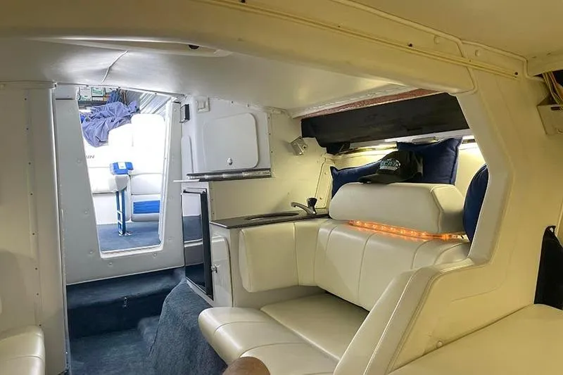  Yacht Photos Pics Interior of a 2001 Fountain 35 Lightning boat with white seating and modern amenities.