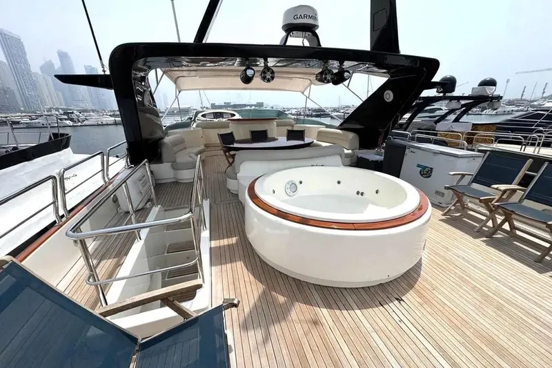  Yacht Photos Pics Luxurious 2004 Azimut 100 Jumbo yacht deck with jacuzzi and seating area.