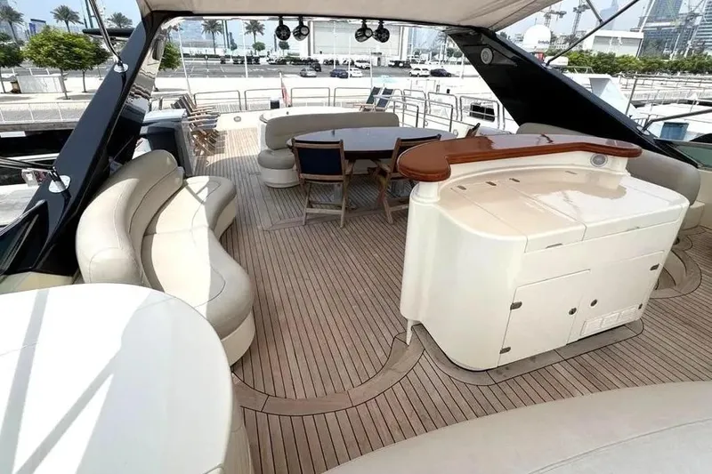  Yacht Photos Pics Luxurious 2004 Azimut 100 Jumbo yacht deck with elegant seating and dining area.