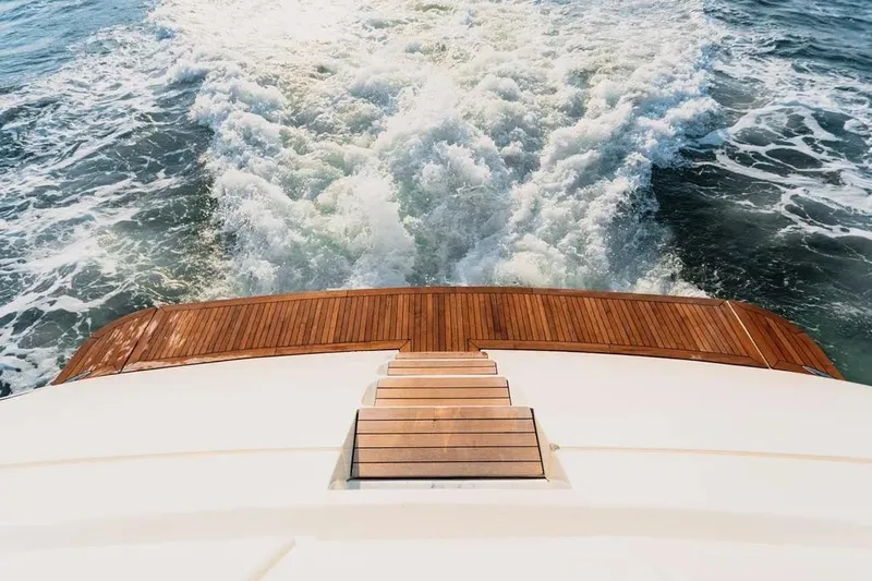  Yacht Photos Pics Azimut 100 Jumbo yacht, 2004 model, cruising with wooden deck and ocean wake.