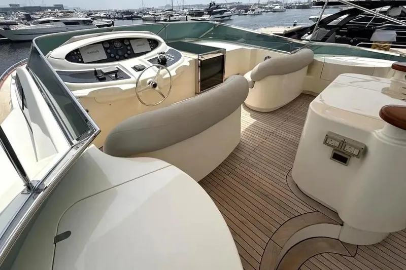  Yacht Photos Pics Luxurious 2004 Azimut 100 Jumbo yacht helm with elegant seating and modern controls.