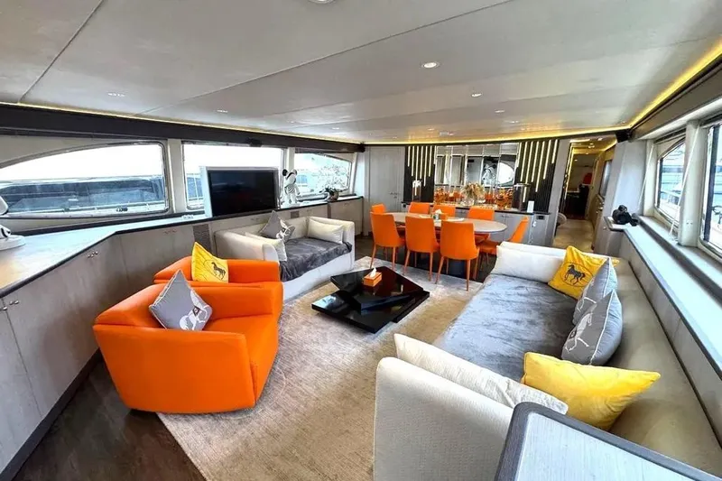  Yacht Photos Pics Luxurious interior of a 2004 Azimut 100 Jumbo yacht with vibrant orange accents.