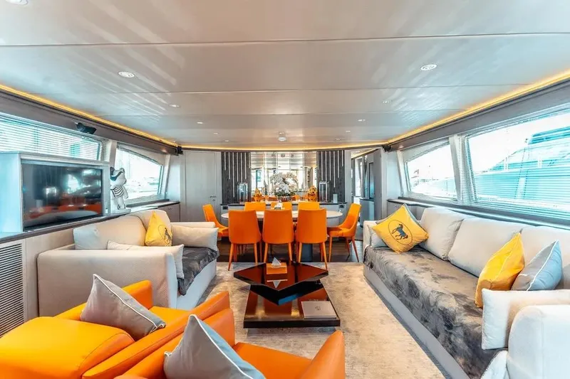  Yacht Photos Pics Luxurious interior of 2004 Azimut 100 Jumbo yacht with modern decor and vibrant orange accents.