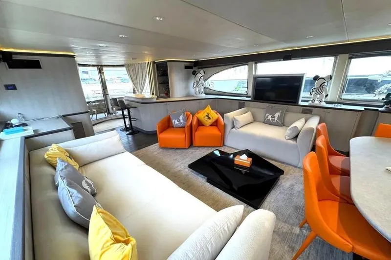  Yacht Photos Pics Luxurious interior of 2004 Azimut 100 Jumbo yacht with modern decor and vibrant seating.