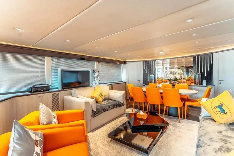  Yacht Photos Pics Luxurious interior of 2004 Azimut 100 Jumbo yacht with vibrant orange seating and modern decor.