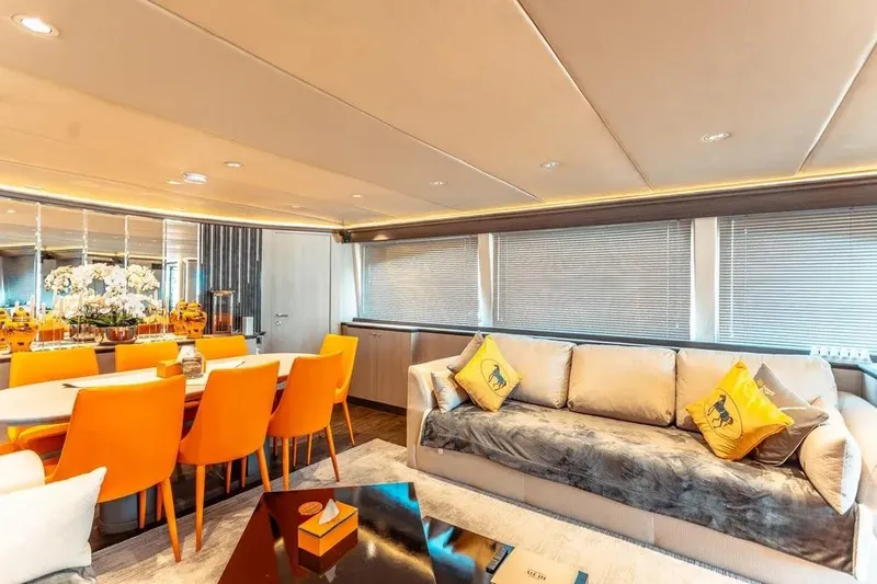  Yacht Photos Pics Luxurious interior of 2004 Azimut 100 Jumbo yacht with vibrant orange dining chairs.