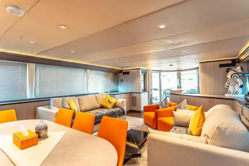  Yacht Photos Pics Luxurious interior of 2004 Azimut 100 Jumbo yacht with modern decor and vibrant seating.