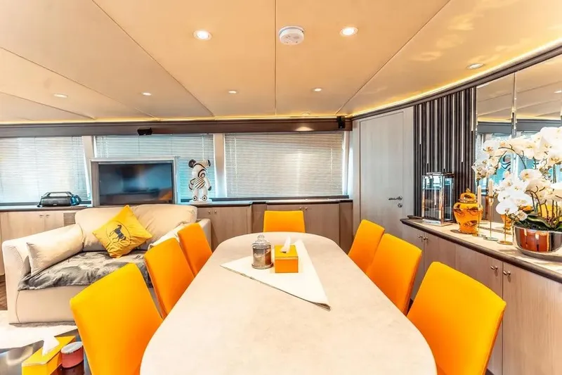  Yacht Photos Pics Luxurious interior of 2004 Azimut 100 Jumbo yacht with vibrant orange chairs and elegant decor.