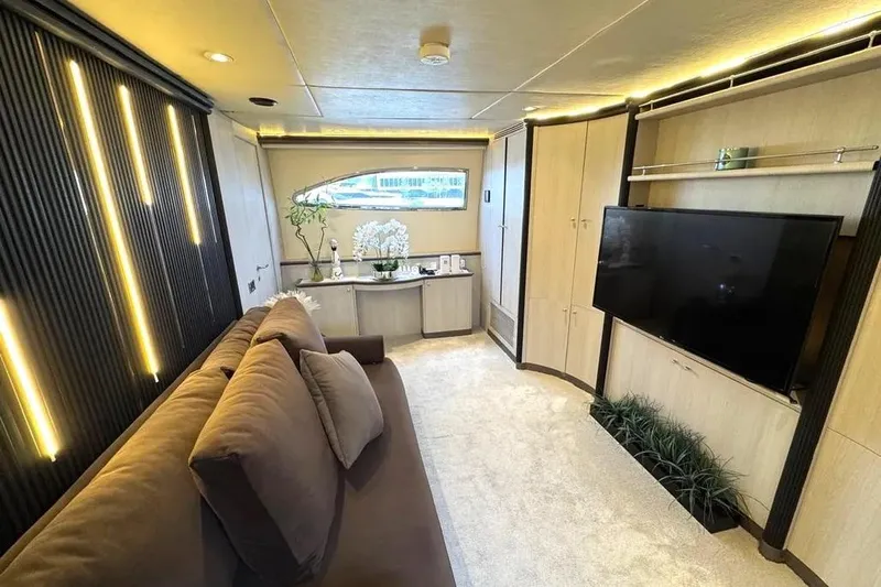  Yacht Photos Pics Luxurious interior of 2004 Azimut 100 Jumbo yacht with modern decor and large TV.