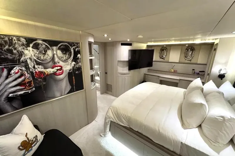  Yacht Photos Pics Luxurious bedroom interior of 2004 Azimut 100 Jumbo yacht with modern art and elegant decor.