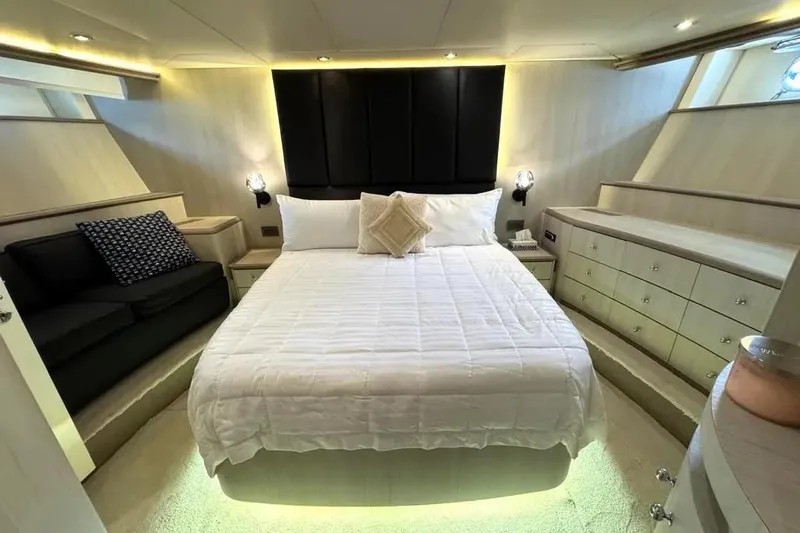 Yacht Photos Pics Luxurious bedroom interior of 2004 Azimut 100 Jumbo yacht with elegant furnishings.