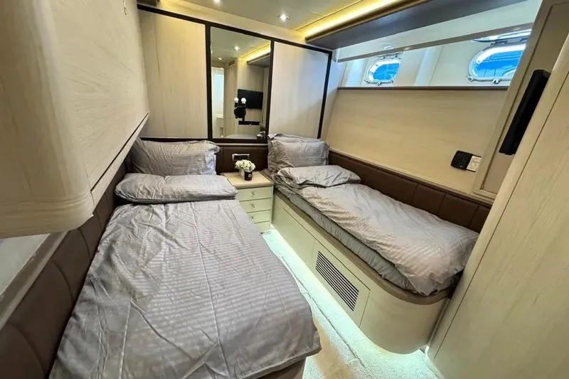  Yacht Photos Pics Luxurious twin cabin interior of 2004 Azimut 100 Jumbo yacht with modern decor.