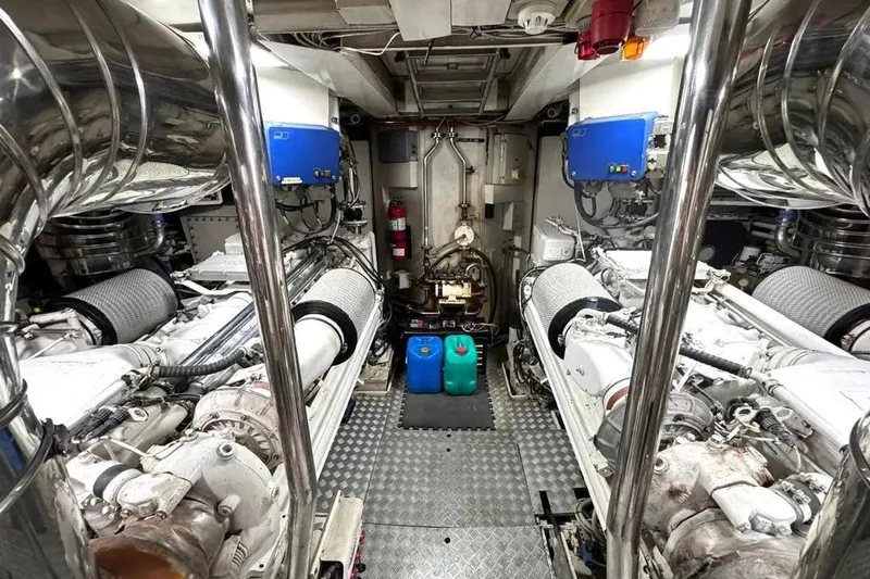  Yacht Photos Pics Engine room of 2004 Azimut 100 Jumbo yacht, featuring dual engines and mechanical equipment.
