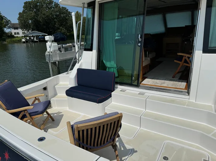 Its A Blast Yacht Photos Pics 2010 Sabre 52 Salon Express yacht deck with seating, near water.