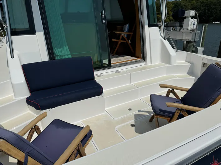 Its A Blast Yacht Photos Pics 2010 Sabre 52 Salon Express yacht deck with seating area and open cabin door.