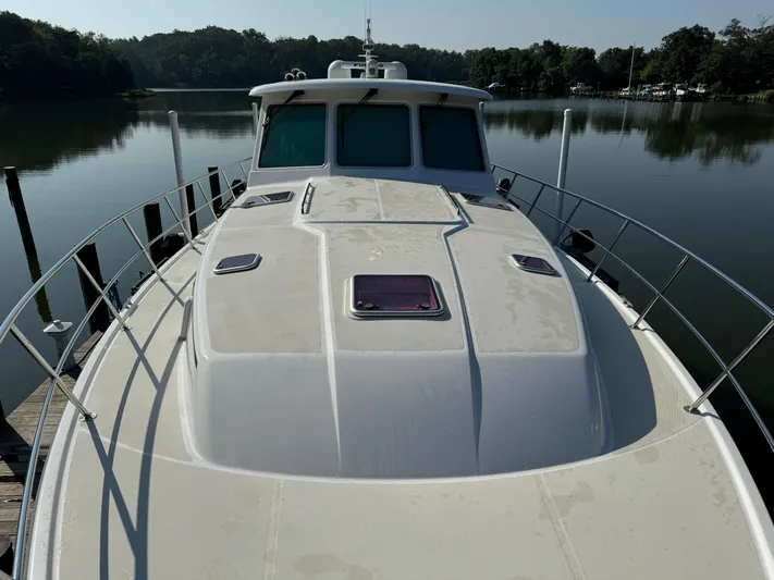 Its A Blast Yacht Photos Pics 2010 Sabre 52 Salon Express yacht docked on a calm lake.