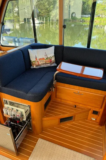 Its A Blast Yacht Photos Pics Interior of 2010 Sabre 52 Salon Express yacht with cozy seating and beverage storage.