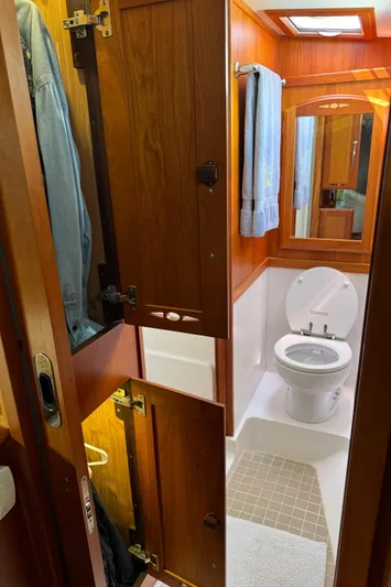 Its A Blast Yacht Photos Pics 2010 Sabre 52 Salon Express bathroom with wooden cabinets and modern fixtures.