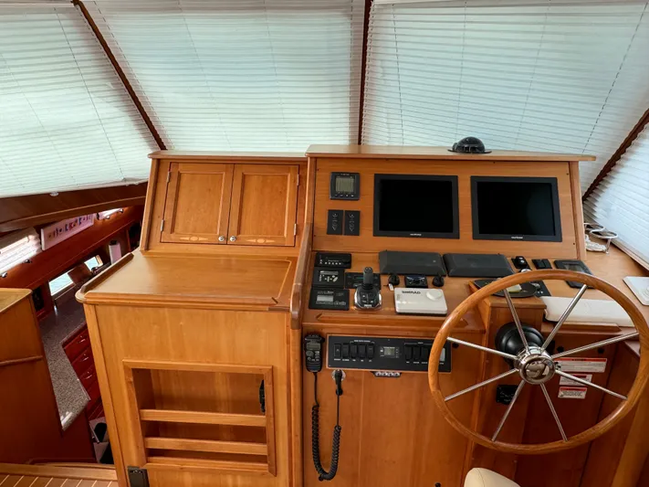 Its A Blast Yacht Photos Pics Interior helm of 2010 Sabre 52 Salon Express with wooden finish and navigation equipment.