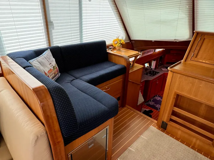 Its A Blast Yacht Photos Pics Interior of 2010 Sabre 52 Salon Express with cozy seating and wooden finishes.