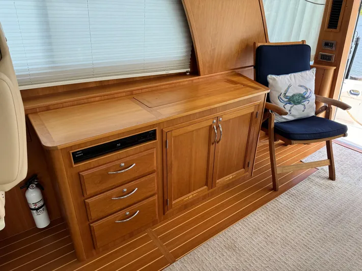 Its A Blast Yacht Photos Pics Interior of 2010 Sabre 52 Salon Express with wooden cabinetry and chair.
