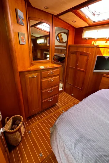 Its A Blast Yacht Photos Pics Interior of 2010 Sabre 52 Salon Express yacht with wooden cabinetry and cozy bedroom.