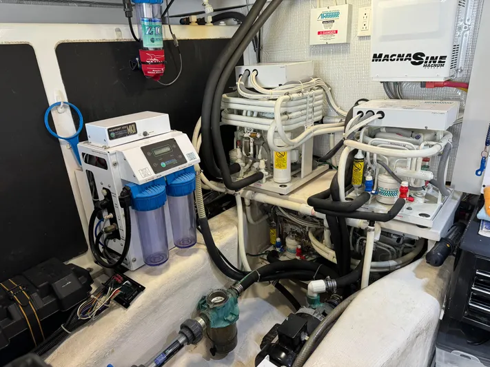 Its A Blast Yacht Photos Pics Engine room of 2010 Sabre 52 Salon Express with complex machinery and wiring.