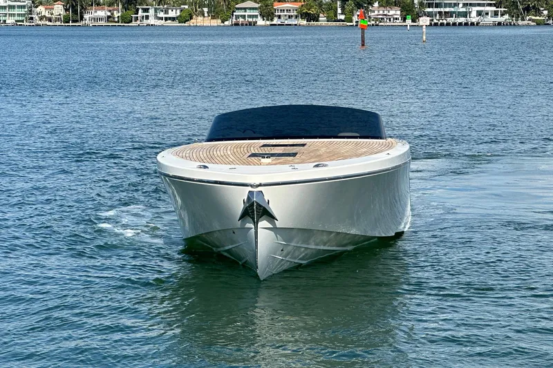 Lolo Yacht Photos Pics 2020 Frauscher 1017 GT luxury boat cruising on a serene waterway.