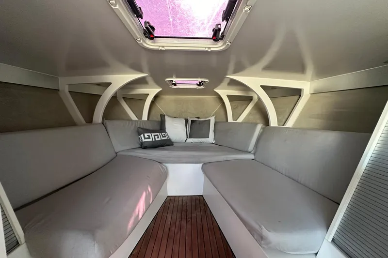 Lolo Yacht Photos Pics Luxurious interior of 2020 Frauscher 1017 GT boat with comfortable seating and cushions.