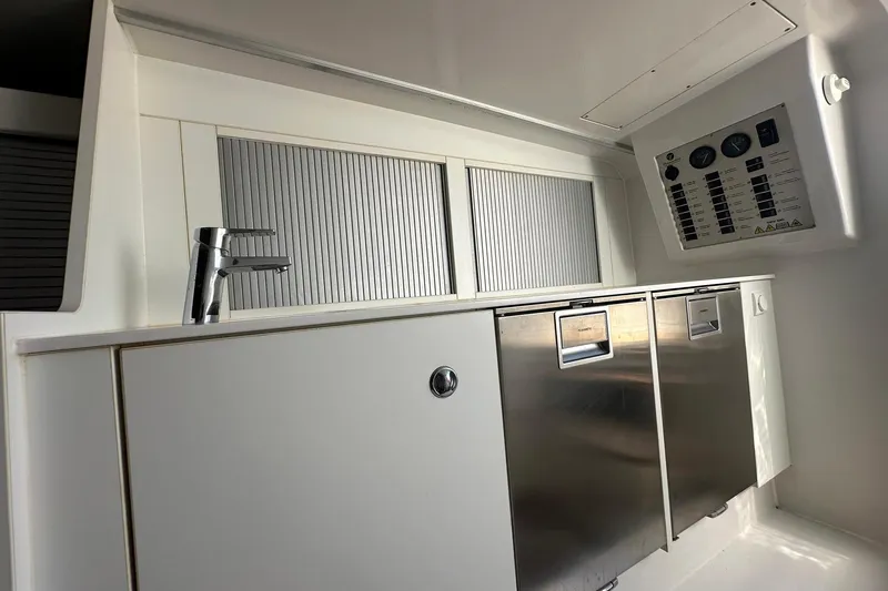 Lolo Yacht Photos Pics Interior of 2020 Frauscher 1017 GT boat featuring sleek cabinetry and control panel.