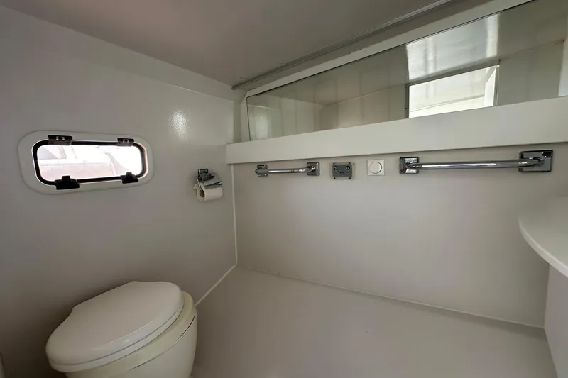 Lolo Yacht Photos Pics 2020 Frauscher 1017 GT boat bathroom interior with window and toilet.