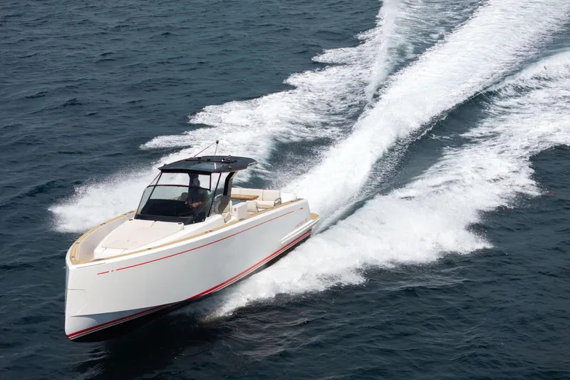 Vector 9 Yacht Photos Pics 2021 Pardo Yachts 38 cruising on open water, creating a dynamic wake.