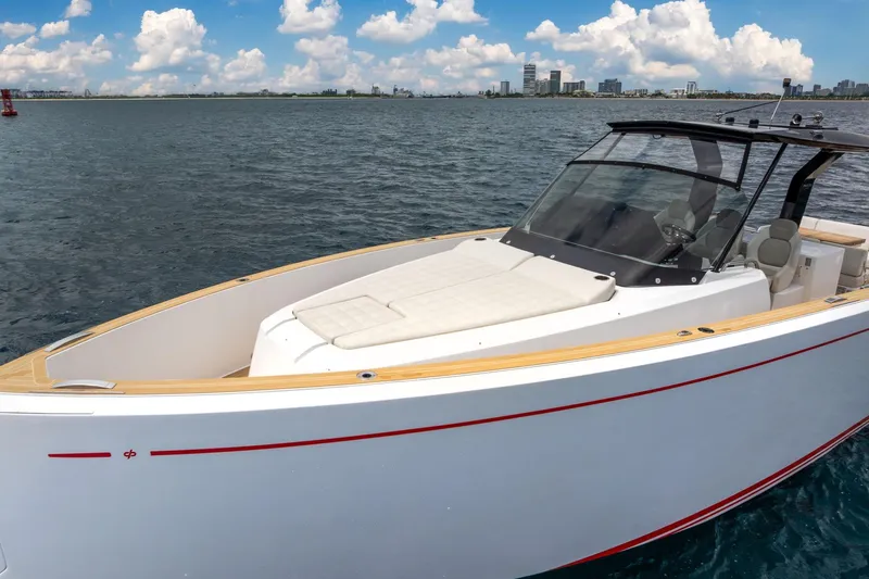 Vector 9 Yacht Photos Pics 2021 Pardo Yachts 38 on water, sleek design, city skyline in background.