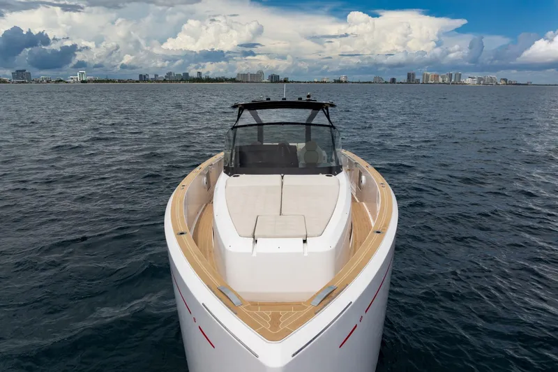 Vector 9 Yacht Photos Pics 2021 Pardo Yachts 38 on open water with city skyline in background.