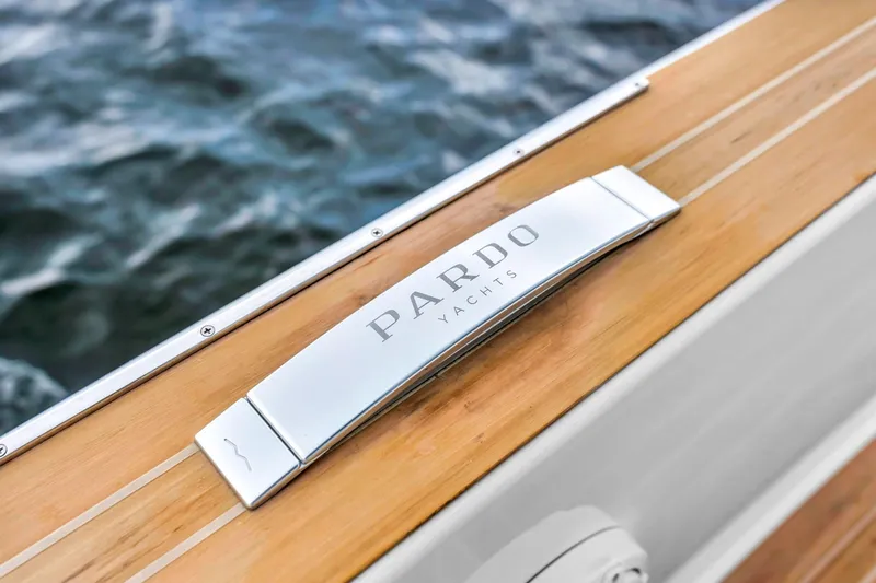 Vector 9 Yacht Photos Pics Pardo Yachts 38, 2021 model, elegant wooden deck detail with ocean backdrop.